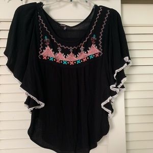 Black top with pastel design